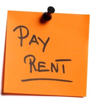 Apartments in Houston’s Energy Corridor A post it note with the word "pay rent" written on it, reminding residents of their monthly obligation in Apartments for rent in Houston's Energy Corridor.
