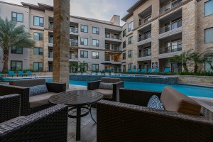 Apartment for rent in Houston's Energy Corridor - Outdoor Patio Area with Seating and View to Pool   