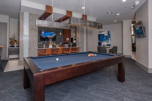 Apartment Rentals in Houston's Energy Corridor - Clubhouse Pool Table with View to Kitchen and TV             