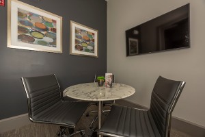 Apartment Rental in Houston's Energy Corridor - Clubhouse Table and Chairs with TV             