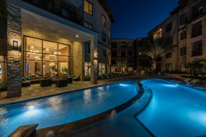 Apartments for rent in Houston's Energy Corridor - Swimming Pool and Clubhouse Lit Up at Night 