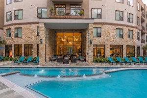Apartment for rent in Houston's Energy Corridor - Swimming Pool and Patio with View to Clubhouse at Dusk